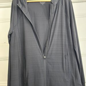 Black Athelta Pacifica Ilume Lightweight Sunprotection Jacket With Finger Holes.